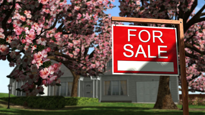 for sale sign in front of real estate for sale